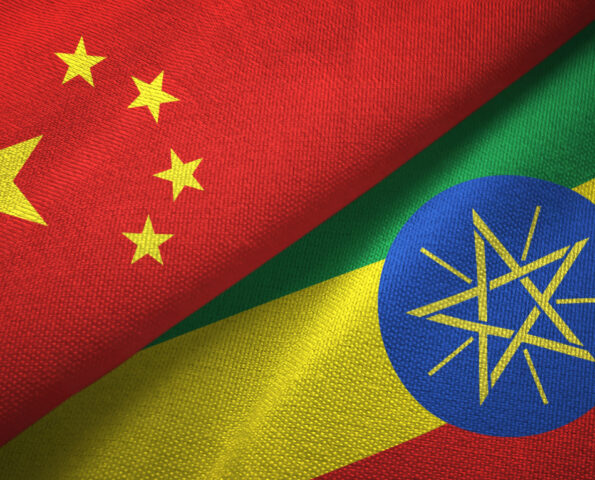 The flags of China and Ethiopia layered next to each other diagonally