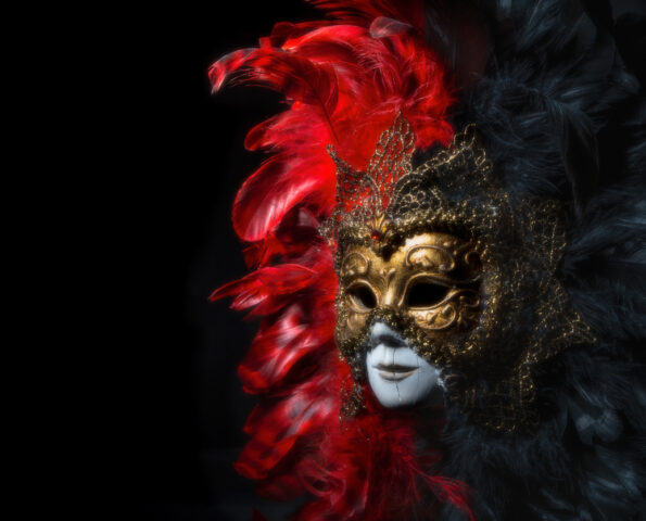 Italian carnival venetian mask on black background. Mysterious event, party